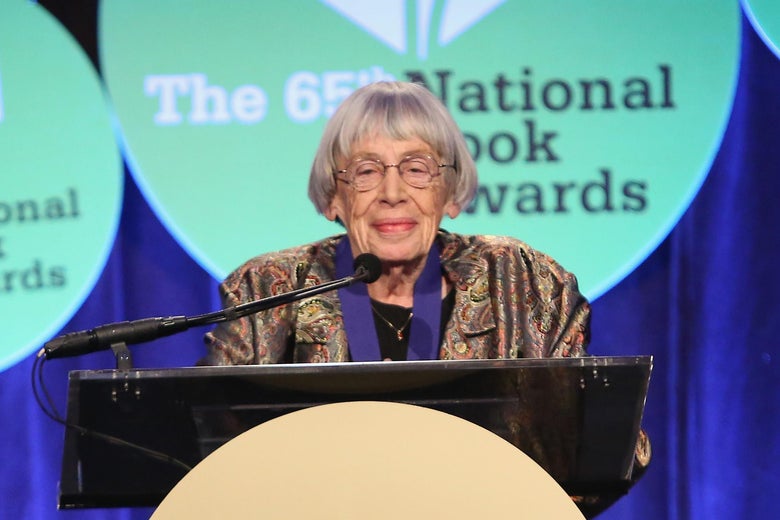 Ursula K. Le Guin stands at a podium.